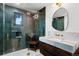 Modern bathroom features glass shower, stylish vanity with marble countertop, and gold fixtures at 4121 S Cherry St, Cherry Hills Village, CO 80113