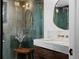 Elegant bathroom showcasing glass shower, marble vanity top, and gold-finished fixtures at 4121 S Cherry St, Cherry Hills Village, CO 80113