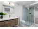 Bathroom with glass shower, wood vanity, modern fixtures and tiled floor at 4121 S Cherry St, Cherry Hills Village, CO 80113