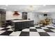 Spacious kitchen featuring a large island, modern lighting, and seamless transition to the dining area at 4121 S Cherry St, Cherry Hills Village, CO 80113