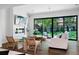 Bright living room with stylish floors, modern furniture, and large windows overlooking the backyard at 4121 S Cherry St, Cherry Hills Village, CO 80113