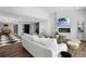 Spacious living room with a modern fireplace, sleek black and white floors, and a contemporary design at 4121 S Cherry St, Cherry Hills Village, CO 80113