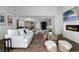 Beautiful living room with a fireplace, modern furniture, and view into kitchen and dining area at 4121 S Cherry St, Cherry Hills Village, CO 80113