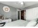 Bright bedroom with large sliding closet doors and modern decorations at 3296 S Bryant St, Englewood, CO 80110