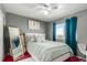 Bedroom features soft lighting, a full-length mirror, and cozy decor at 3296 S Bryant St, Englewood, CO 80110
