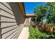 Exterior view of a home featuring a front door and well-manicured landscaping at 3296 S Bryant St, Englewood, CO 80110