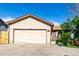 Charming single-Gathering home featuring a large two-car garage, neutral siding, and mature landscaping at 3296 S Bryant St, Englewood, CO 80110