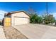 Spacious two-car garage with a wide driveway and well-maintained surroundings at 3296 S Bryant St, Englewood, CO 80110