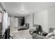 Comfortable living area featuring modern decor, seating, and tile flooring for a cozy and inviting ambiance at 3296 S Bryant St, Englewood, CO 80110