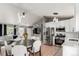 Open-concept living space combines the kitchen, dining area, and living room for a spacious and inclusive feel at 3296 S Bryant St, Englewood, CO 80110