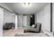 Neutral toned living area with seating, tile floors and natural light at 3296 S Bryant St, Englewood, CO 80110