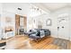 Inviting living room featuring a decorative fireplace, hardwood floors, and natural light at 3289 Perry St, Denver, CO 80212