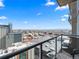 Breathtaking city view from balcony, featuring seating and a sleek railing at 891 14Th St # 3410, Denver, CO 80202