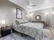Cozy bedroom with soft gray bedding, ceiling fan, and stylish decor at 891 14Th St # 3410, Denver, CO 80202
