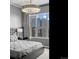 Serene bedroom featuring a plush bed, cityscape views, and stylish decor at 891 14Th St # 3410, Denver, CO 80202