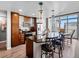Well-equipped kitchen featuring wooden cabinets, stainless steel appliances, and an island with barstool seating at 891 14Th St # 3410, Denver, CO 80202