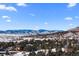 Community view showcasing snowy mountain range and homes at 83 Castle Pines N Dr, Castle Rock, CO 80108