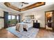 Main bedroom with hardwood floors and access to private balcony at 83 Castle Pines N Dr, Castle Rock, CO 80108