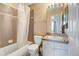 Well-maintained bathroom with a shower-tub combo and a neutral color scheme at 9403 Southern Hills Cir, Lone Tree, CO 80124