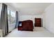 Bright bedroom with sloped ceilings features a large window and carpeted flooring at 9403 Southern Hills Cir, Lone Tree, CO 80124