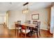 Elegant dining room featuring hardwood floors and a stylish light fixture at 9403 Southern Hills Cir, Lone Tree, CO 80124