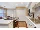 Kitchen featuring stainless steel appliances, light countertops and white cabinets plus hardwood floors at 9403 Southern Hills Cir, Lone Tree, CO 80124