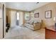 Neutral living room featuring a comfortable couch, access to a balcony, and lots of natural light at 9403 Southern Hills Cir, Lone Tree, CO 80124