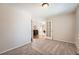 Neutral bedroom with carpeted flooring and view into the adjacent living space at 23808 E Bellewood Dr, Aurora, CO 80016