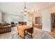 Spacious living room with hardwood floors, neutral tones, and a smooth transition to a carpeted living area at 23808 E Bellewood Dr, Aurora, CO 80016