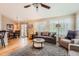 Spacious living room with a casual dining area and lots of natural light from the many windows at 23808 E Bellewood Dr, Aurora, CO 80016