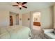 Comfortable main bedroom with ensuite bathroom access, soft carpet, and a large bed for relaxation at 23808 E Bellewood Dr, Aurora, CO 80016