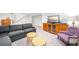 Spacious finished basement with stairs and comfortable seating and entertainment area at 1100 Pontiac St, Denver, CO 80220