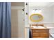 This bathroom features a shower, single sink, and toilet with hardwood floors at 1100 Pontiac St, Denver, CO 80220