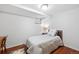 This bedroom features a wood frame bed, hardwood floors and one window for great natural light at 1100 Pontiac St, Denver, CO 80220
