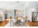 Elegant dining room featuring hardwood floors, stylish lighting, and comfortable seating at 1100 Pontiac St, Denver, CO 80220