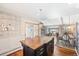 Kitchen with a center island, stainless steel appliances, and an adjacent dining area at 1100 Pontiac St, Denver, CO 80220