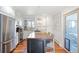 Kitchen with stainless steel appliances, granite countertops, and a center island at 1100 Pontiac St, Denver, CO 80220