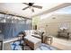 This patio features an outdoor couch, lighting and plenty of seating and a ceiling fan at 1100 Pontiac St, Denver, CO 80220