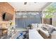 This patio features an outdoor couch, TV, lighting and plenty of seating at 1100 Pontiac St, Denver, CO 80220