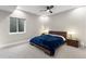 Cozy bedroom features a plush blue comforter, neutral walls and a ceiling fan at 741 Green Mountain Dr, Erie, CO 80516