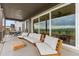 The covered patio boasts comfortable seating for enjoying the outdoor scenery at 741 Green Mountain Dr, Erie, CO 80516