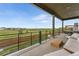Outdoor seating on a covered patio with beautiful landscaping at 741 Green Mountain Dr, Erie, CO 80516