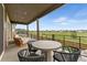 Relaxing covered patio features stylish furniture and overlooks a beautiful open space at 741 Green Mountain Dr, Erie, CO 80516