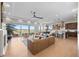 Bright open-concept living area with hardwood floors, fireplace, and large windows with expansive views at 741 Green Mountain Dr, Erie, CO 80516