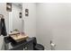 Modern powder room with vessel sink, black fixtures, and stylish pendant lighting at 741 Green Mountain Dr, Erie, CO 80516