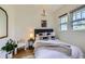 Bedroom features modern decor, neutral tones, and ample natural light at 513 Mt Blue Sky Rd, Golden, CO 80401