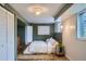 Cozy bedroom features a comfortable bed, soft rug, and a window for natural light at 513 Mt Blue Sky Rd, Golden, CO 80401