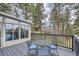 Entertain on this covered deck with table and seating for four while enjoying gorgeous mountain views from inside the sunroom at 513 Mt Blue Sky Rd, Golden, CO 80401