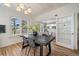 Dining room featuring hardwood floors, white walls, and large windows at 513 Mt Blue Sky Rd, Golden, CO 80401