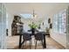 Bright dining room features a stone fireplace, skylight and large windows at 513 Mt Blue Sky Rd, Golden, CO 80401